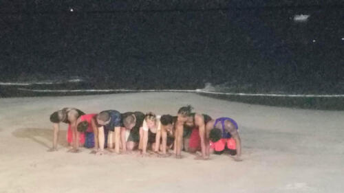 Kids Kneeling on Beach